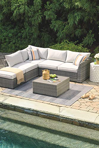 Signature Design by Ashley Outdoor Cherry Point 4 Piece Seating Set with Ottoman & Cocktail Table, Gray